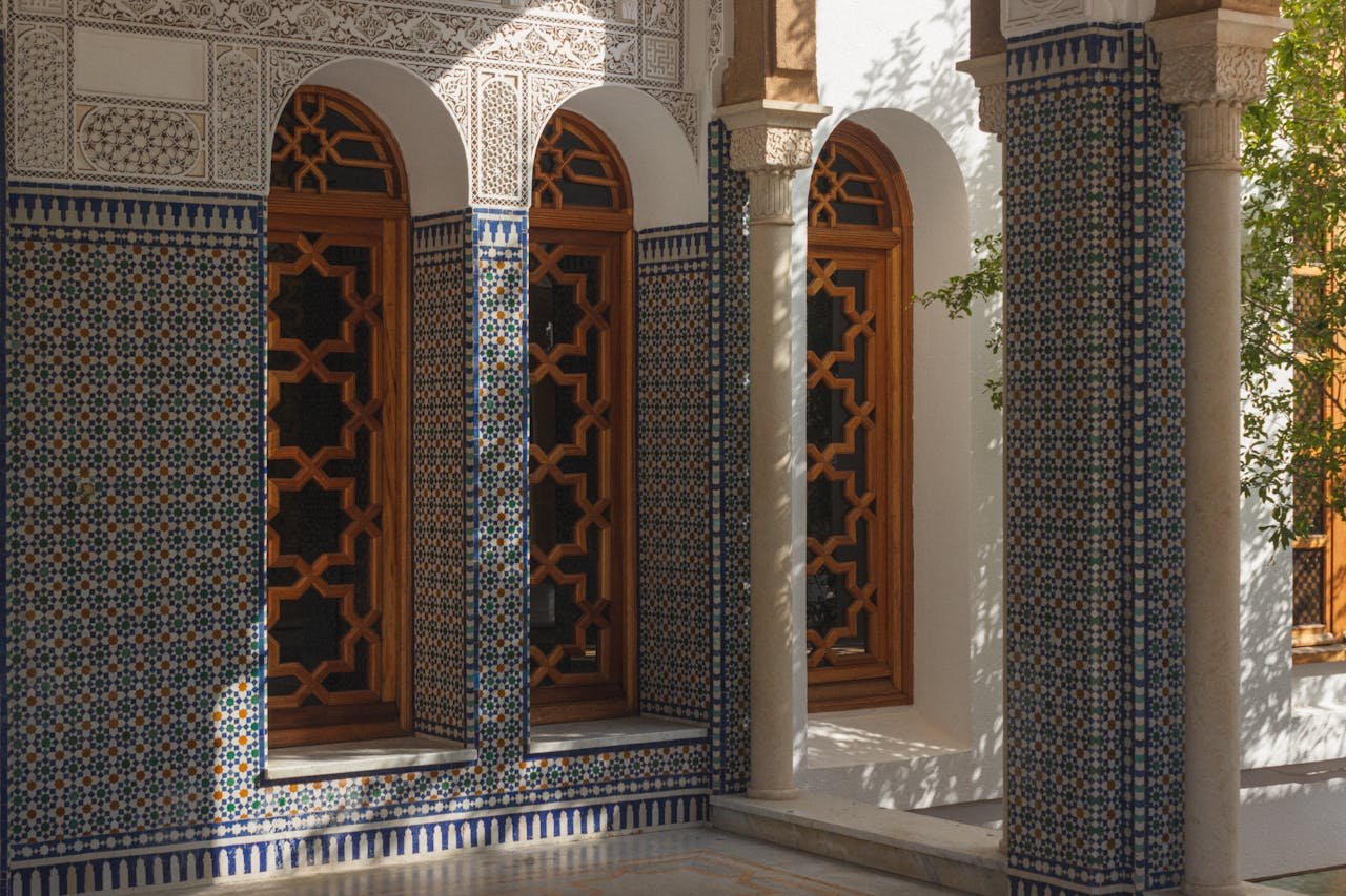 Mastering the First Impression: Your intriguing post title goes here Beautiful Moroccan architecture featuring intricate tile work and elegant wooden windows.