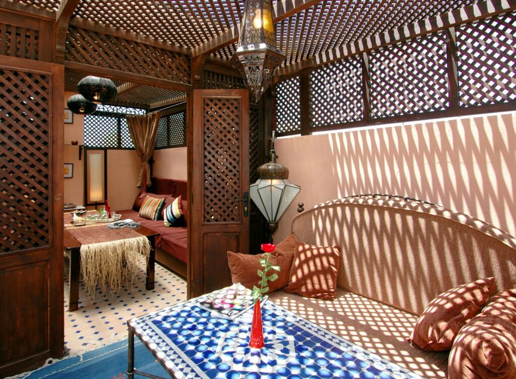 pexels photo 9143738 9143738 Beautiful traditional Moroccan interior with sunlight patterns and intricate decor.